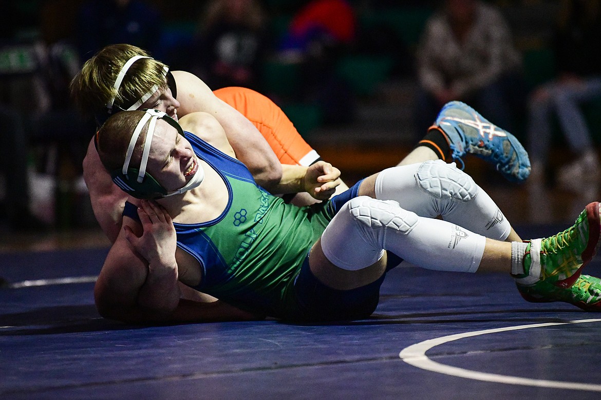 Flathead's Colton Kuka wrestles Glacier's Shannon Hughes at 160 lbs. at Glacier High School on Thursday, Jan. 18. (Casey Kreider/Daily Inter Lake)