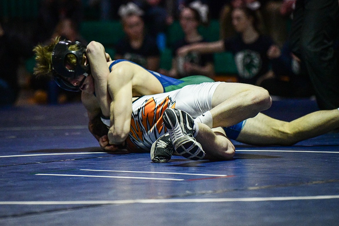 Glacier's Kaleb Shine wrestles Flathead's Dane Lake at 145 lbs. at Glacier High School on Thursday, Jan. 18. (Casey Kreider/Daily Inter Lake)