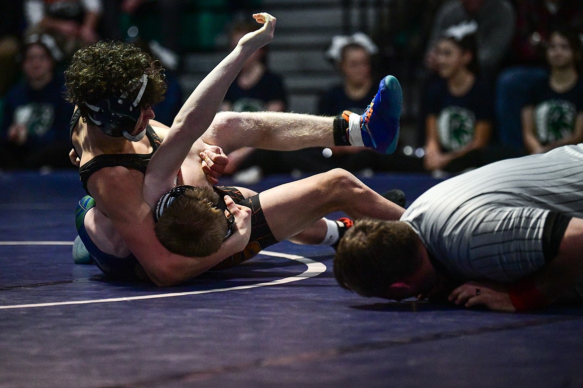 Flathead's Hunter Arriaga wrestles Glacier's Garrett Bosch at 120 lbs. at Glacier High School on Thursday, Jan. 18. (Casey Kreider/Daily Inter Lake)