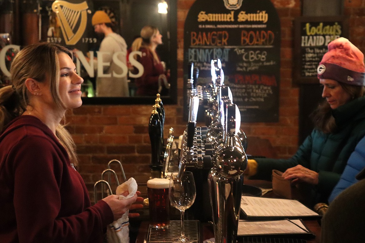 Justine Adams talks to customers during Beer Choir night at Crown and Thistle Pub on Thursday.