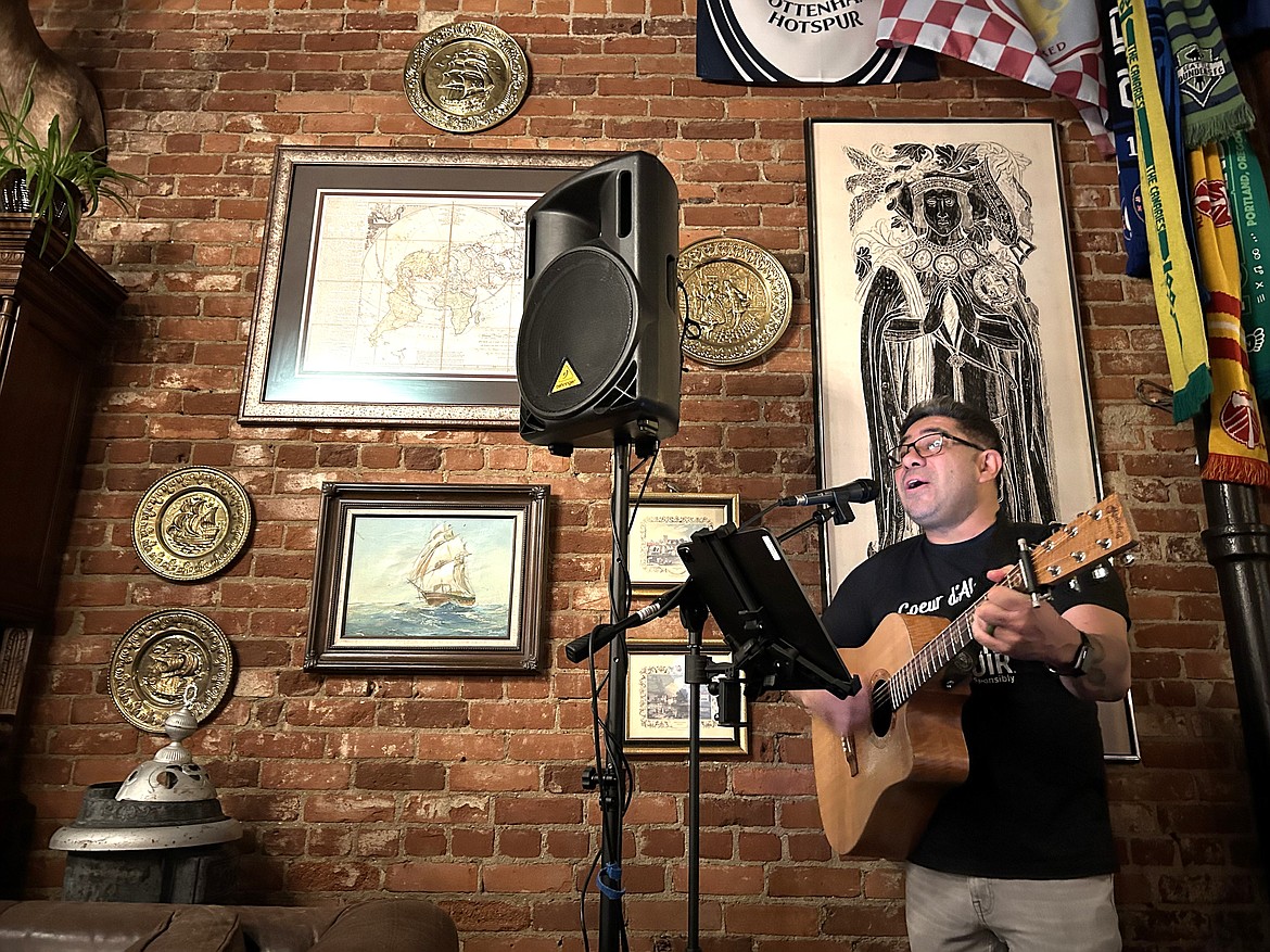 Max Mendez leads Beer Choir at Crown and Thistle Pub on Thursday.