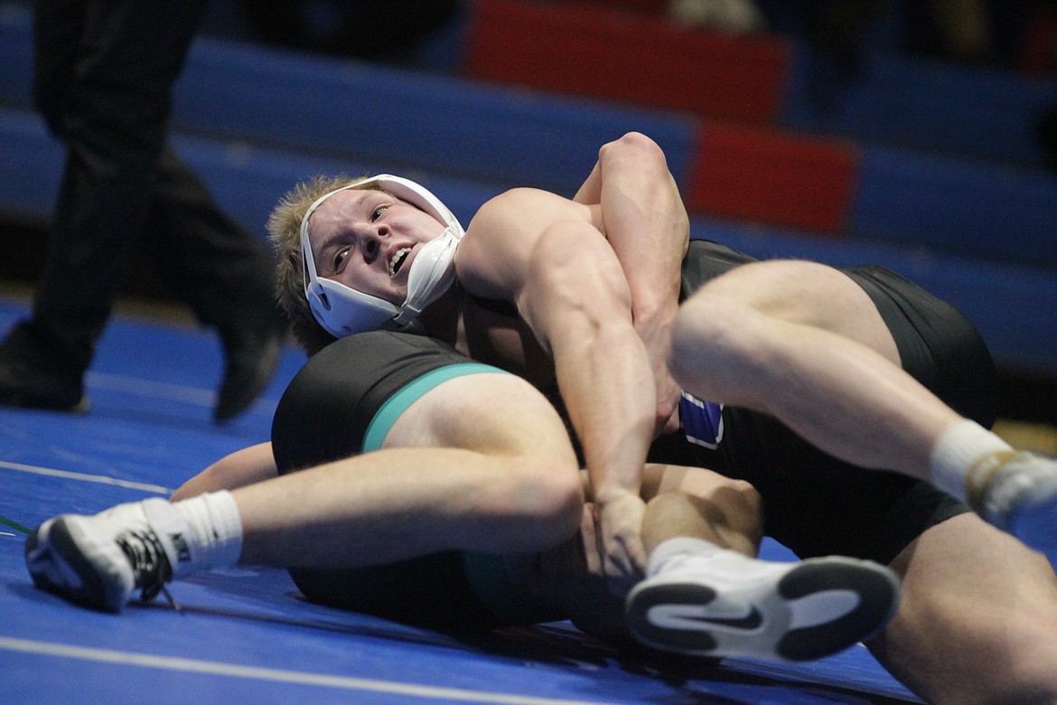 JASON ELLIOTT/Press
Coeur d'Alene senior Gabe Grassel closes in on a pin at 182 pounds over Lake City junior Gabe Wullenwaber during the TerHark Cup dual at Coeur d'Alene High on Thursday.