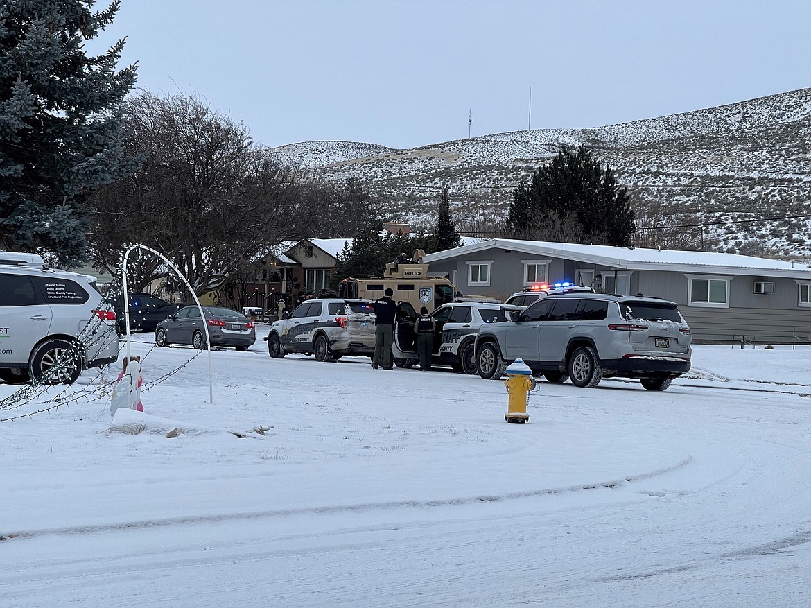 Law enforcement officers at the scene of a shooting in Ephrata Thursday. A 31-year-old man eventually was taken into custody on suspicion of attempted murder.