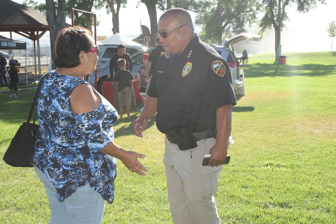 Mattawa Police Chief Robert Salinas talks with a resident during the first National Night Out in Mattawa in August 2022.