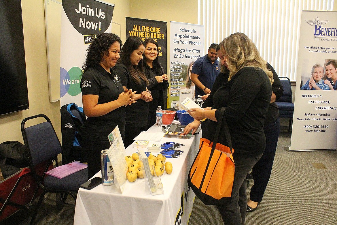 McCain Food staff talk to prospective employees about opportunities at the company during an October SkillSource job fair in Moses Lake. McCain will also be present at the Othello hiring event Jan. 26.