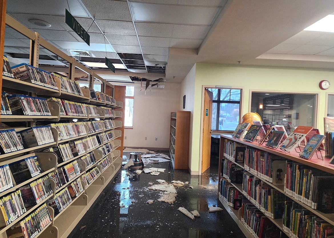Water and pieces of ceiling are seen Sunday on the floor of the Post Falls Library. The Post Falls and Athol libraries are closed for water mitigation following weather-related damage. The Athol Library experienced a broken water pipe in an exterior wall. The Post Falls Library experienced catastrophic failure of its fire suppression system.