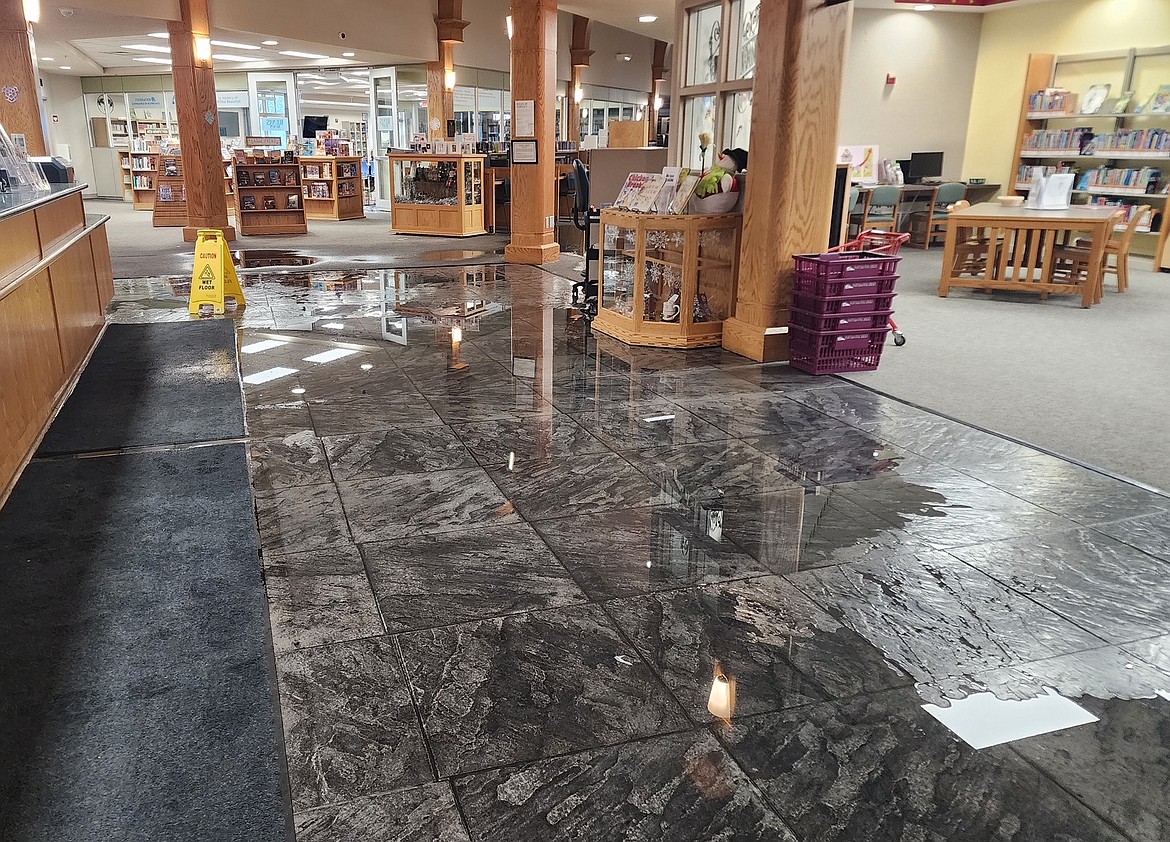 Water is all over the floor Sunday after the Post Falls Library experienced a catastrophic failure of its fire suppression system due to the winter weather. The damage is widespread and includes computers, equipment, tables, furnishings and books as well as drywall, ceilings, lighting, electrical and flooring. The Post Falls and Athol libraries are closed due to weather damage.