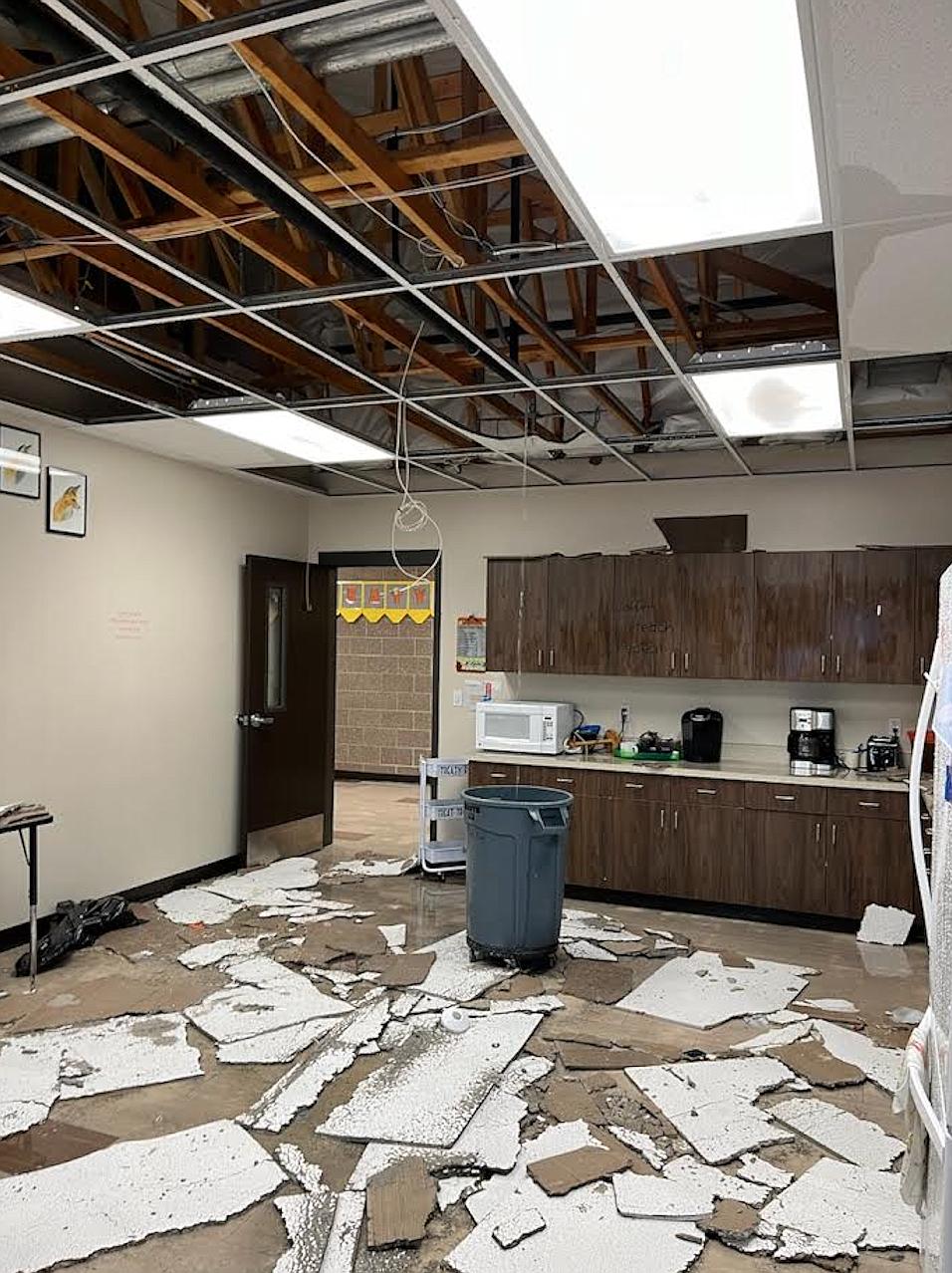 Ceiling tiles are scattered on the floor of the staff room at Treaty Rock Elementary School in Post Falls after the fire suppression system broke and caused water damage earlier this week due to severe winter weather.