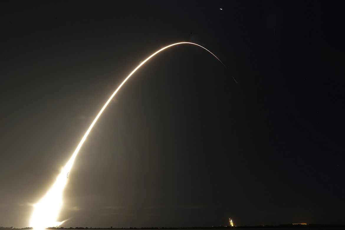 This time exposure photo shows a SpaceX Falcon 9 rocket, with a payload including two lunar rovers from Japan and the United Arab Emirates, launching from Launch Complex 40 at the Cape Canaveral Space Force Station in Cape Canaveral, Fla., on Dec. 11, 2022. But later in April 2023, the spacecraft from a Japanese company apparently crashed while attempting to land on the moon. Japan now hopes to make the world's first "pinpoint landing" on the moon early Saturday, Jan. 20, 2024, joining a modern push for lunar contact with roots in the Cold War-era space race between the United States and the Soviet Union. (AP Photo/John Raoux, File)