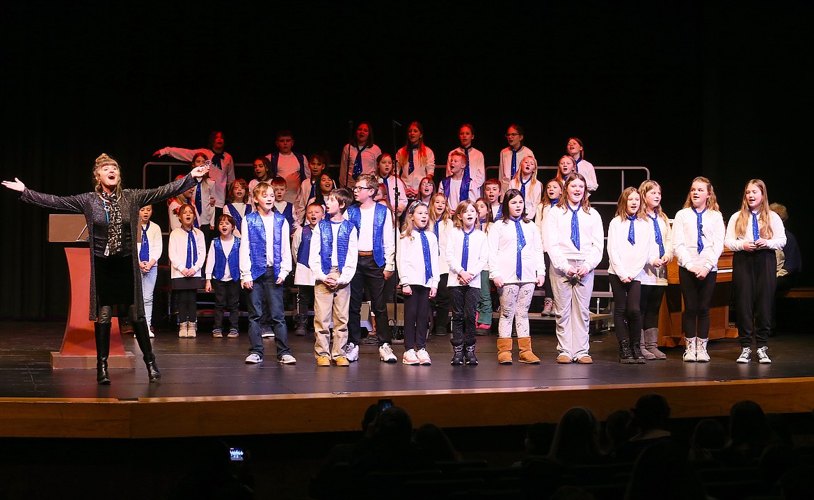 Music teacher Julie Powell and the Bryan Special Choir lead a "True Colors" sing-along Friday morning during the 37th annual Dr. Martin Luther King Jr. Human Rights Celebration in the Schuler Performing Arts Center at North Idaho College.