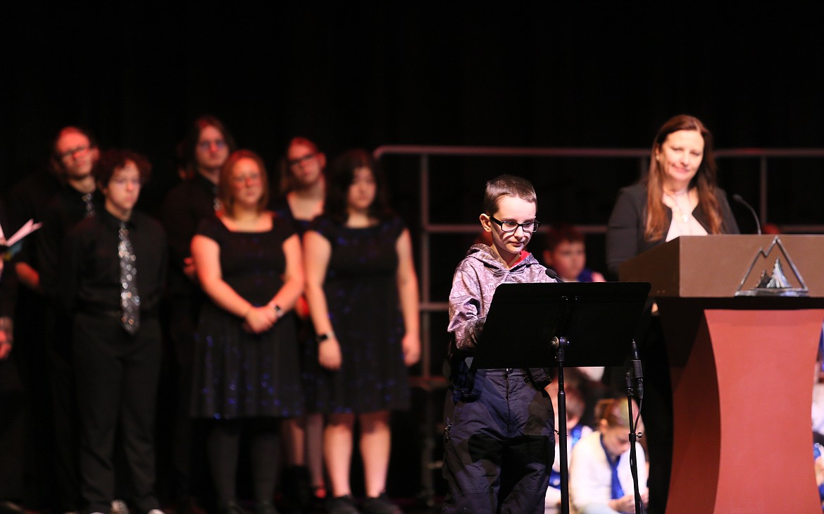 Atlas Elementary fifth grader Jonah Swofford reads his essay about trust, respect and empathy Friday morning during the 37th annual Dr. Martin Luther King Jr. fifth grade program at North Idaho College. The program was sponsored by the Coeur d'Alene School District, NIC, Kristine Hoover of Gonzaga University and the Kootenai County Task Force on Human Relations.