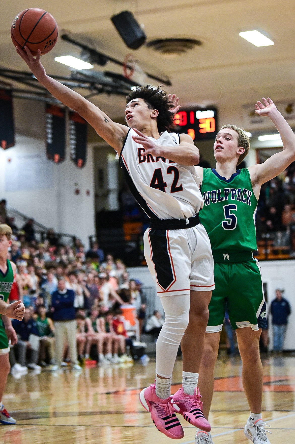 Flathead's Jordan Griffin (42) drives to the basket guarded by Glacier's Easton Kauffman (5) in the second half at Flathead High School on Friday, Jan. 19. (Casey Kreider/Daily Inter Lake)