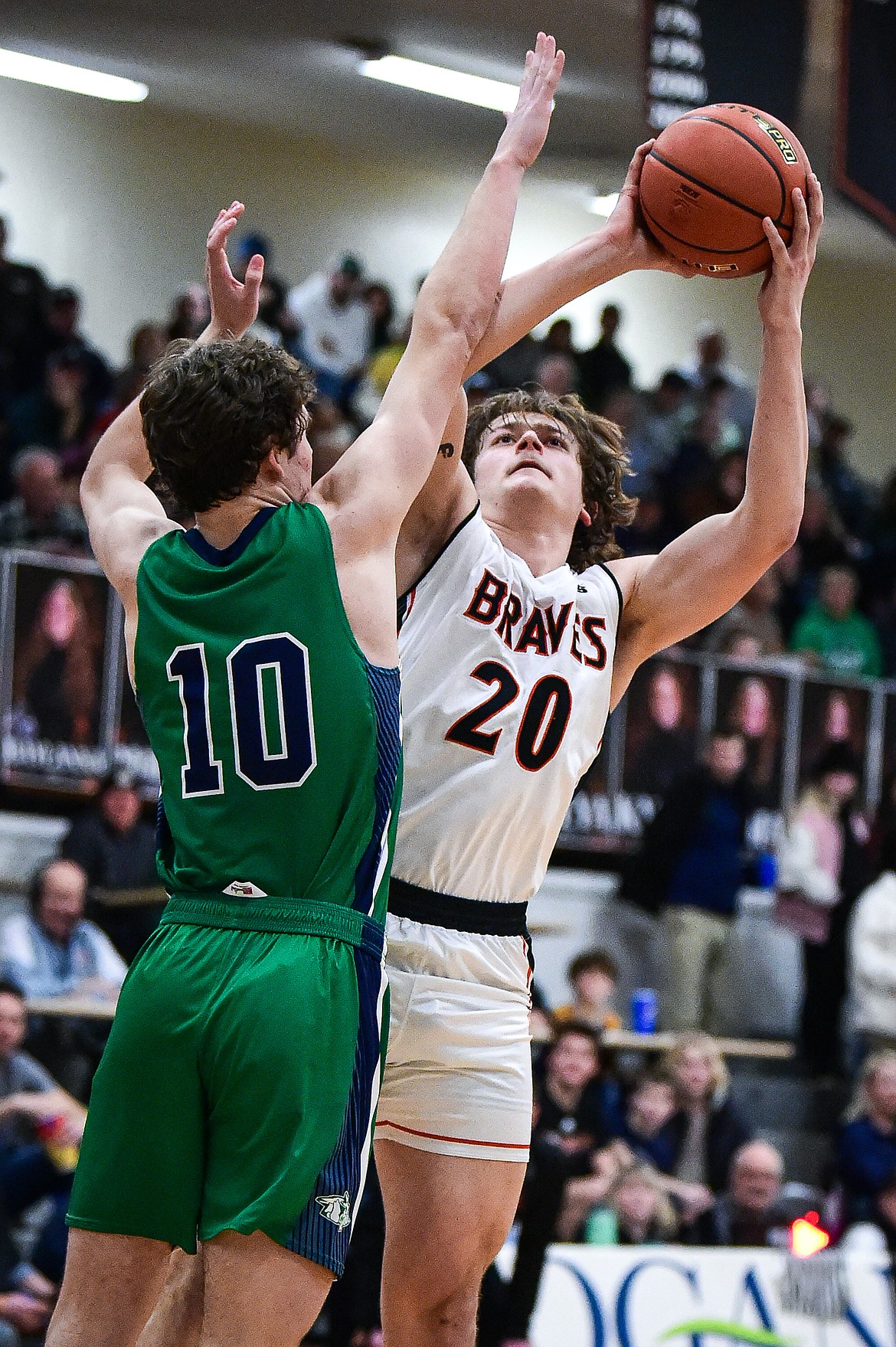 Flathead's Gabe Sims (20) shoots guarded by Glacier's Brantly Salmonsen (10) in the second half at Flathead High School on Friday, Jan. 19. (Casey Kreider/Daily Inter Lake)