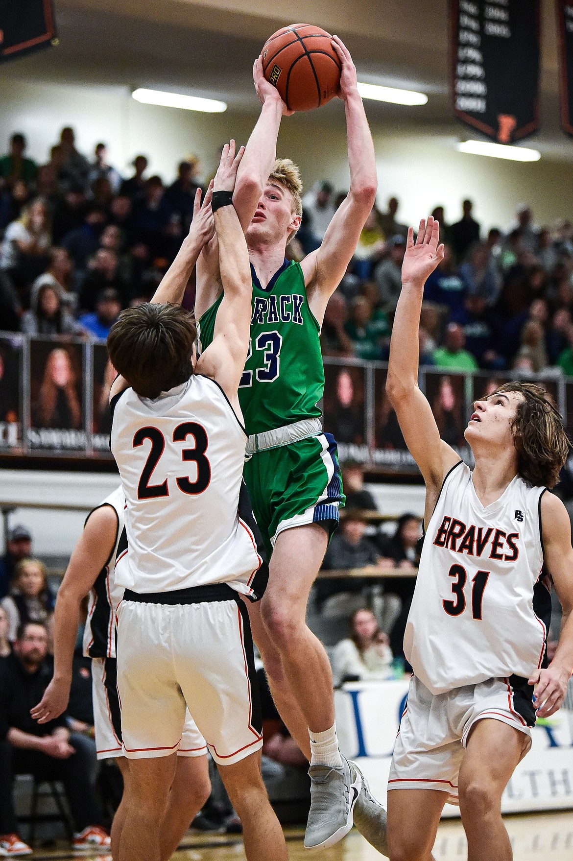 Glacier's Jackson Endresen (23) is fouled on his way to the basket in the first half against Flathead at Flathead High School on Friday, Jan. 19. (Casey Kreider/Daily Inter Lake)