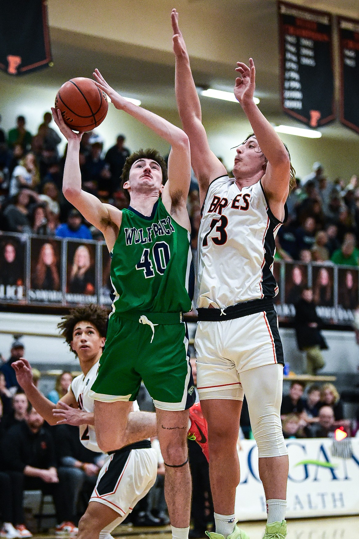 Glacier's Noah Cummings (40) drives to the basket guarded by Flathead's Lyric Ersland (13) in the first half at Flathead High School on Friday, Jan. 19. (Casey Kreider/Daily Inter Lake)