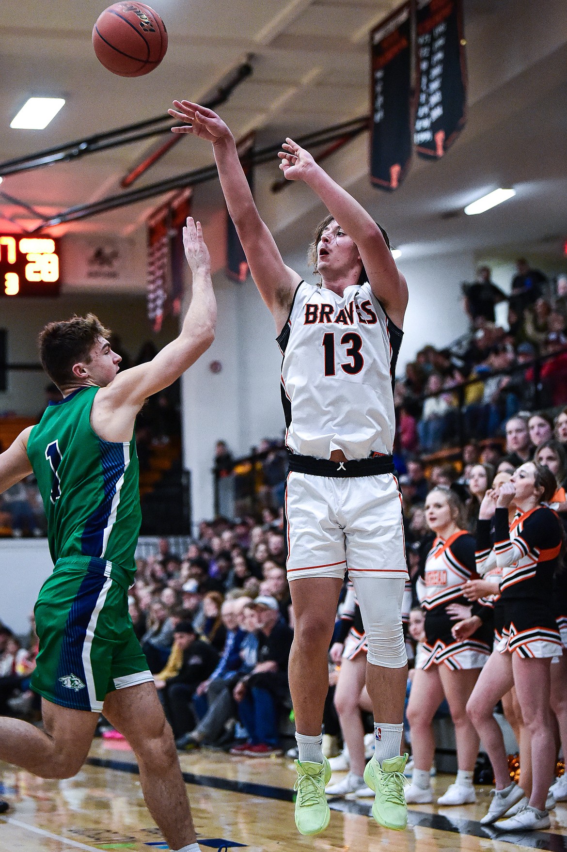 Flathead's Lyric Ersland (13) shoots a three guarded by Glacier's Cohen Kastelitz (1) in the second half at Flathead High School on Friday, Jan. 19. (Casey Kreider/Daily Inter Lake)