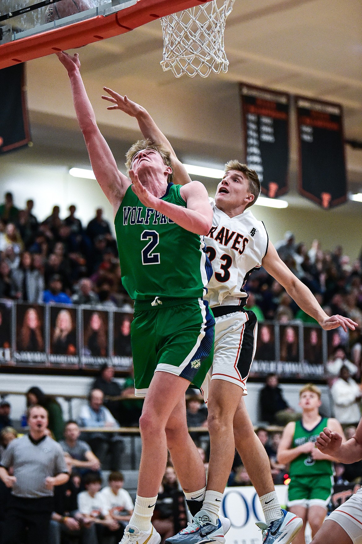 Glacier's Liam Ells (2) drives to the basket guarded by Flathead's Korbin Eaton (33) in the first half at Flathead High School on Friday, Jan. 19. (Casey Kreider/Daily Inter Lake)