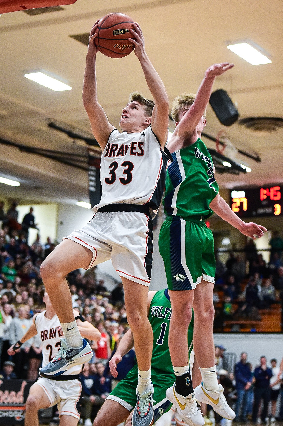 Flathead's Korbin Eaton (33) drives to the basket in the second half against Glacier at Flathead High School on Friday, Jan. 19. (Casey Kreider/Daily Inter Lake)