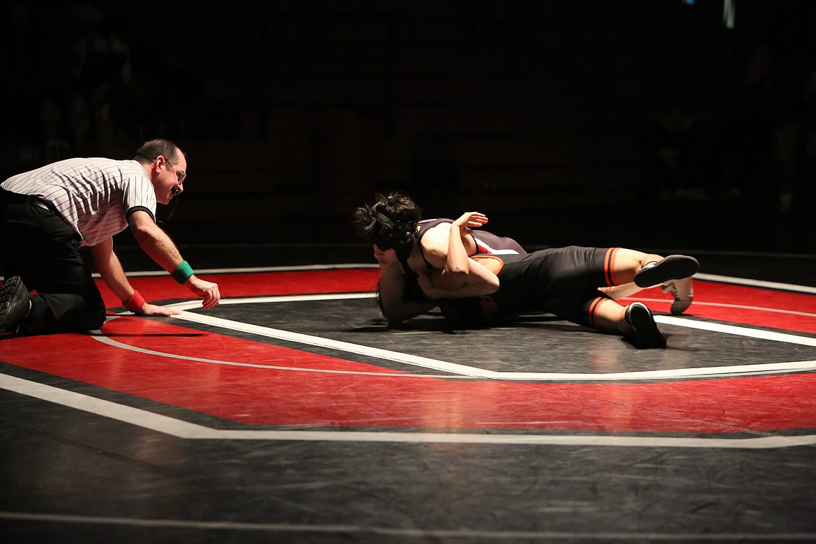 Othello junior Christopher Garcia, top, works to flip West Valley (Spokane)’s Jaxn Fraser.