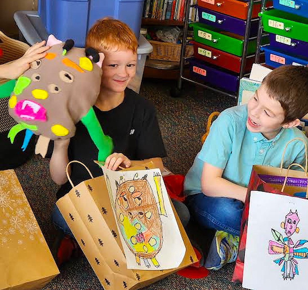 Owen Basler, left, with his monster Bob, and Drake Cole are getting ready to share their monsters. (Berl Tiskus/Leader)