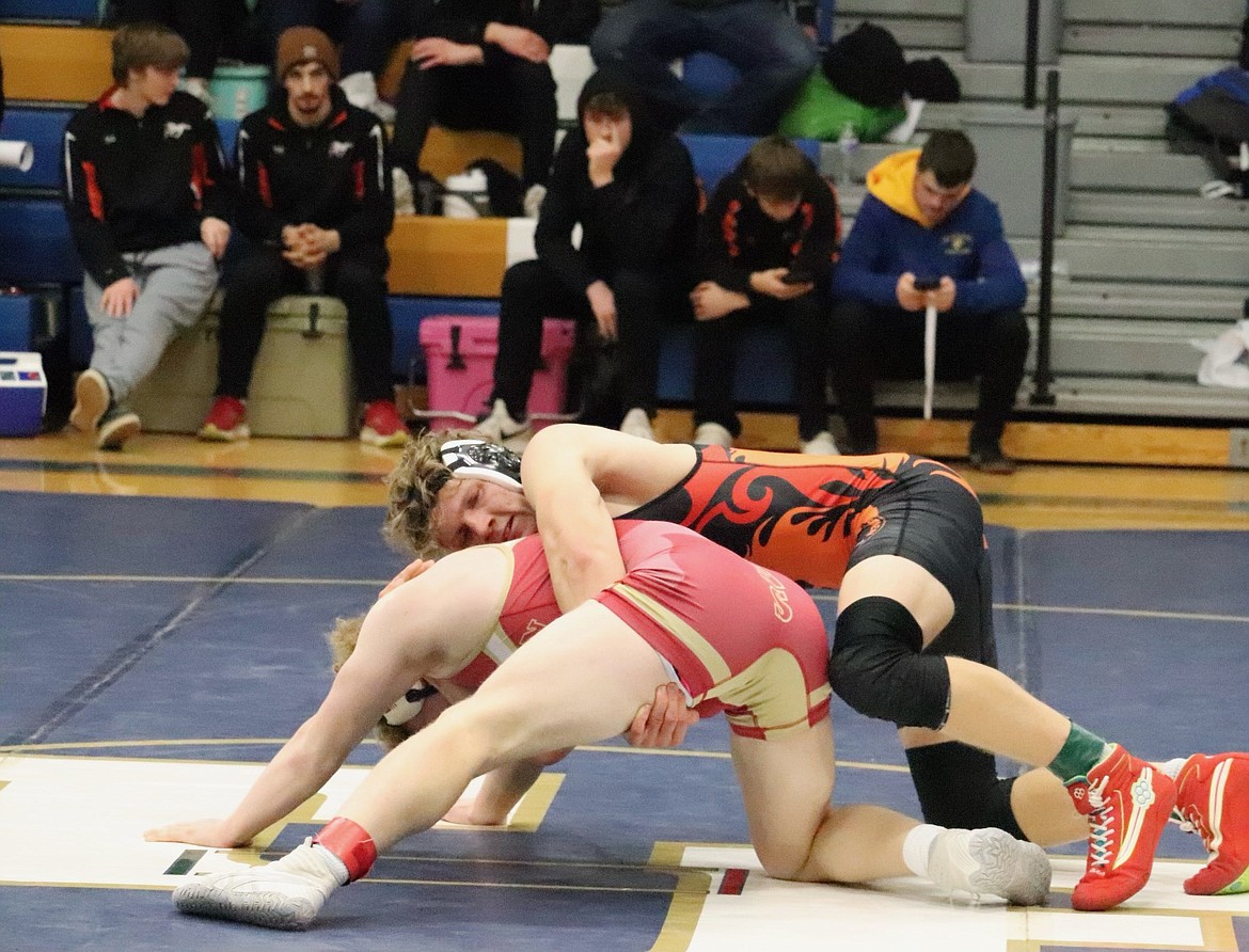 Plains/Hot Springs wrestler David Chapman (orange) controls his opponent during a match at 170 during the Ted Kato tournament this past Saturday in Thompson Falls. (Photo by Kami Milender)