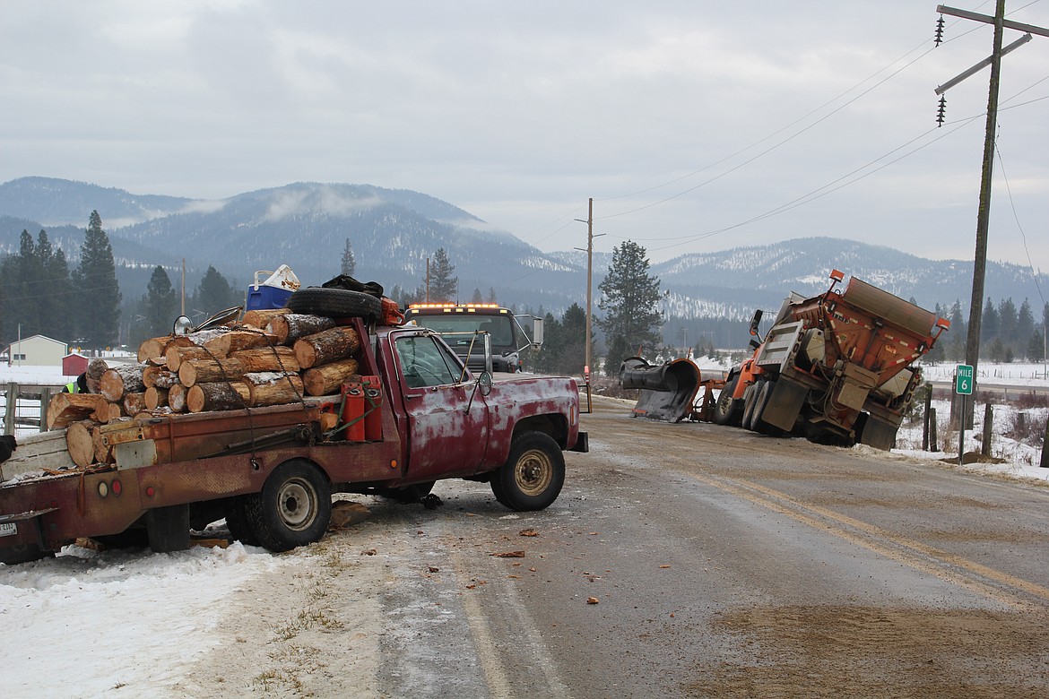 There were no injuries at mile marker 6 on east Mullan Road outside of Superior when a vehicle crossed the center line and made contact with a Montana DOT snowplow. Ice was reported as a key factor in the collision. (Monte Turner/Mineral Independent)