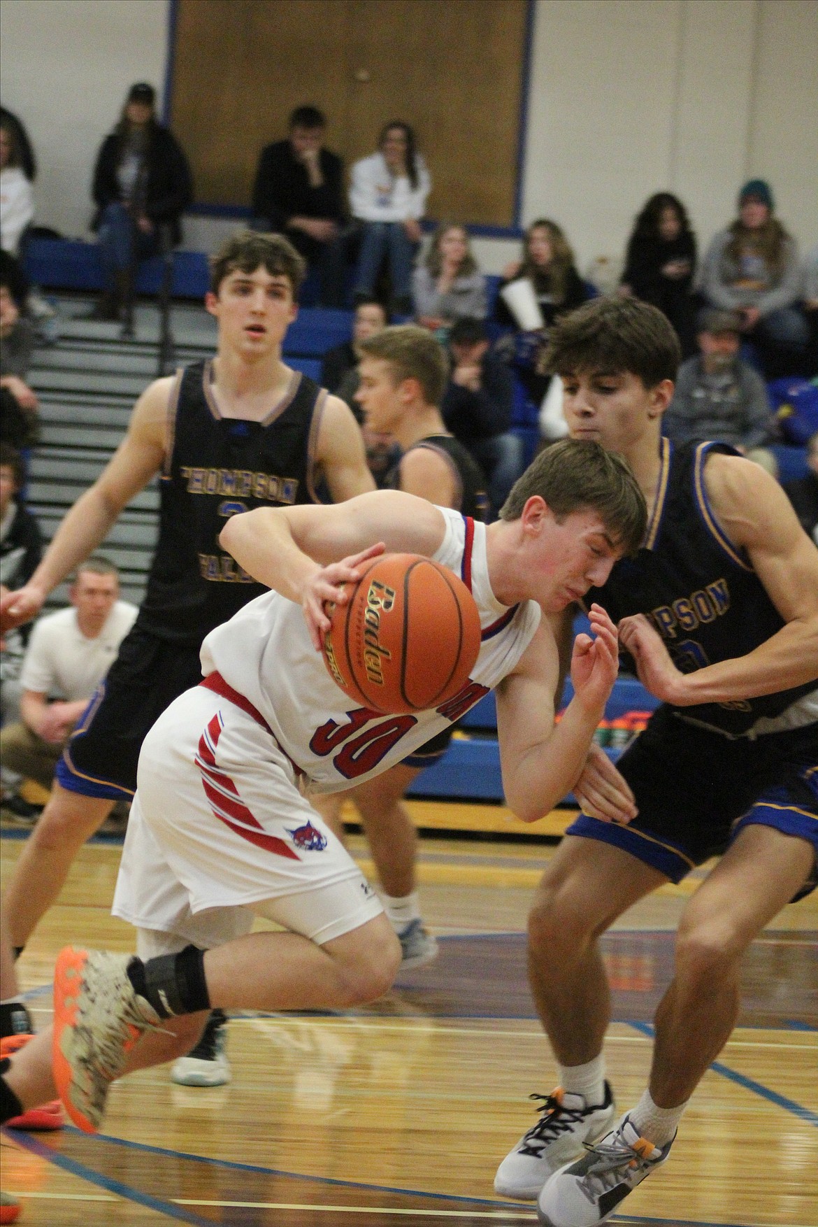 Superior freshman guard Gannon Quinland tries to drive through the Thompson Falls defense during their game Saturday night in Superior.  (Photo by Sydnie Smallley)