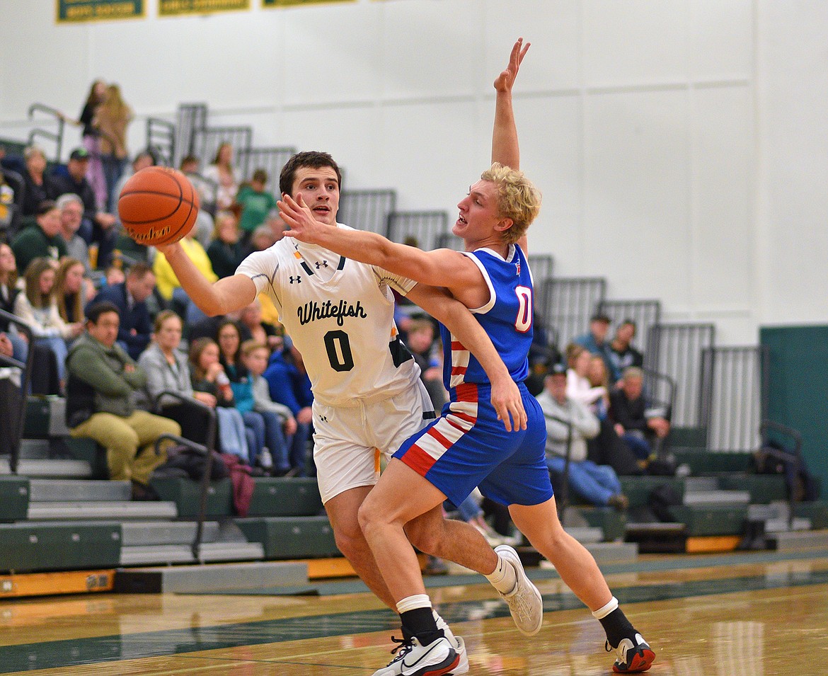 Whitefish's Carson Gulick makes a pass on a fast break opportunity against Bigfork on Friday in Whitefish. (Whitney England/Whitefish Pilot)