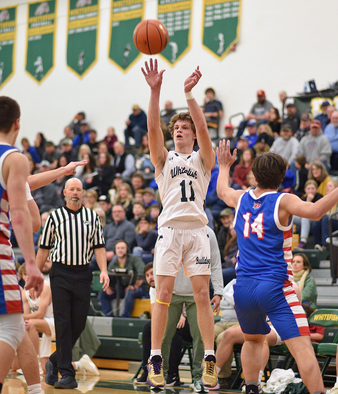 Whitefish's CJ Thew hits a jumper against Bigfork on Friday in Whitefish. (Whitney England/Whitefish Pilot)