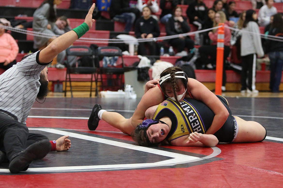 Othello senior Elia Velazquez, top, wrestles in the finals of the 190-pound bracket of the Lady Huskie Invitational on Saturday. Velazquez was one of three Othello wrestlers to reach the finals of Saturday’s tournament.