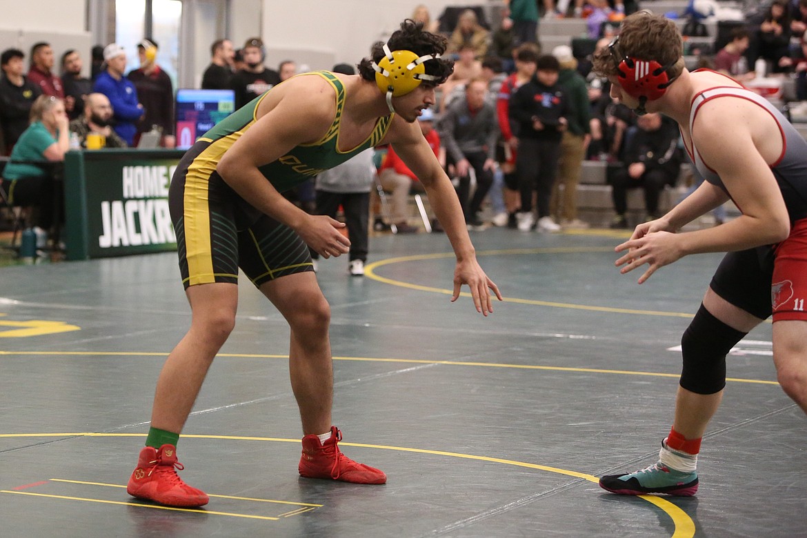 Quincy sophomore Alejandro Barajas, left, took third in the 190-pound bracket at Saturday’s Mat Animal Invitational in Quincy.