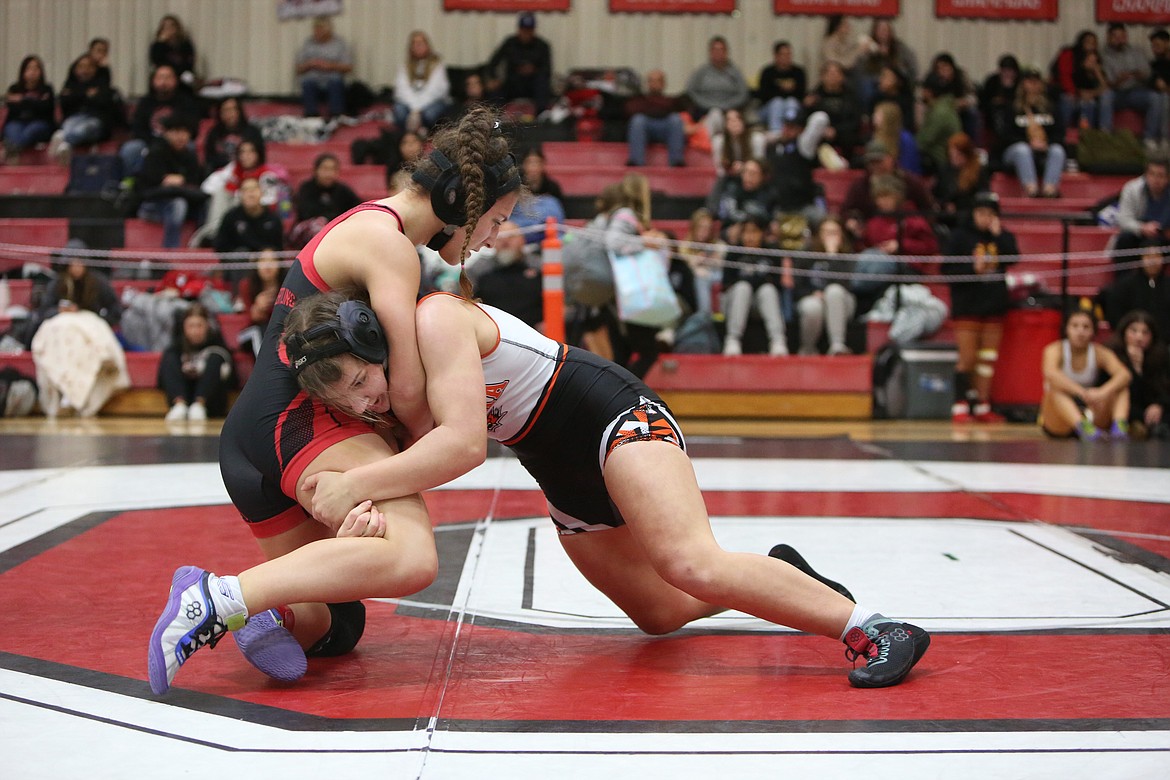 Ephrata senior Kadie McMullen, right, defeated Othello sophomore Kiara Haertling, left, in the finals of the 145-pound bracket at the Huskie Invitational on Saturday.