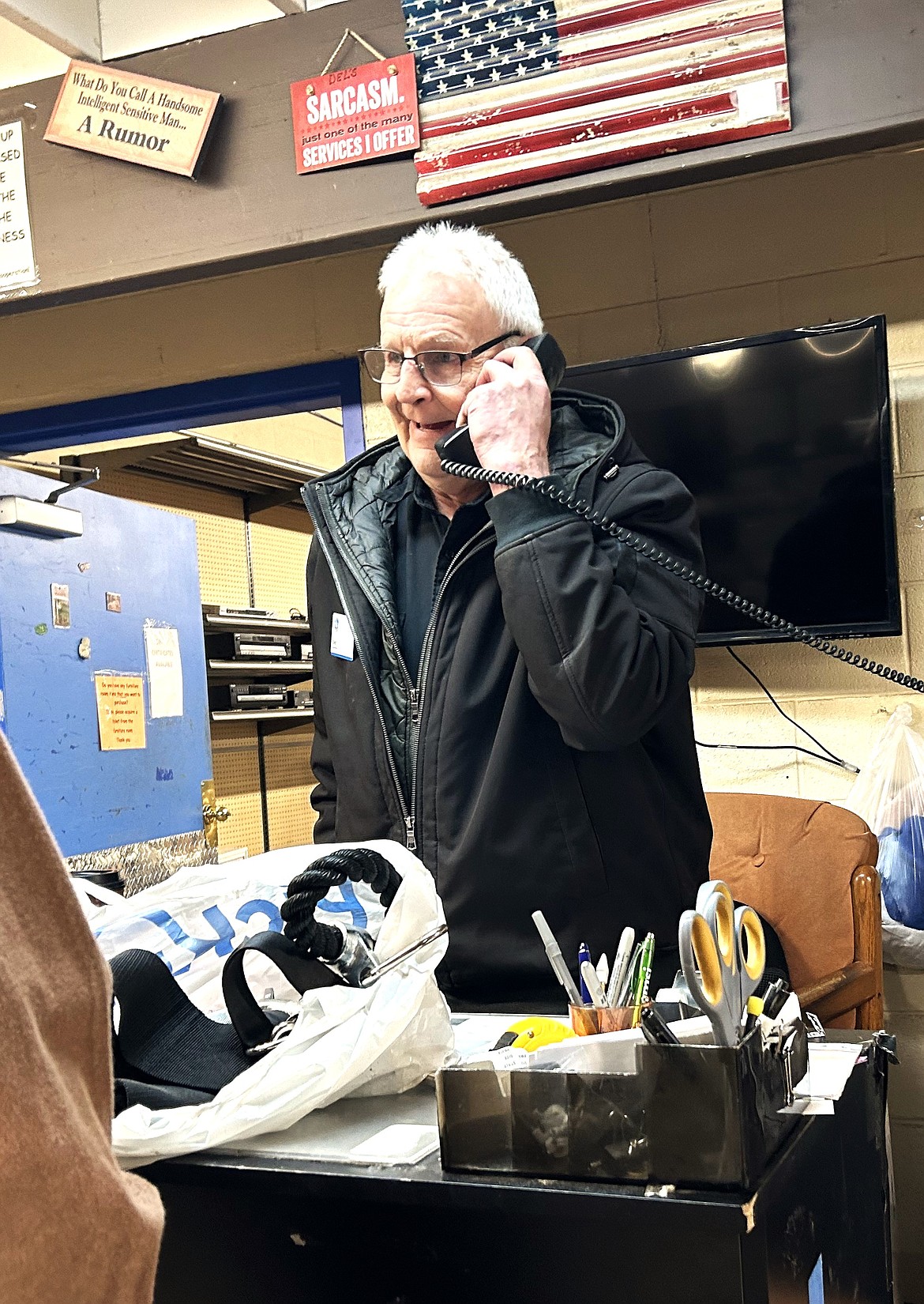 Del Simchuk chats on the phone at St. Vincent de Paul North Idaho on Tuesday.