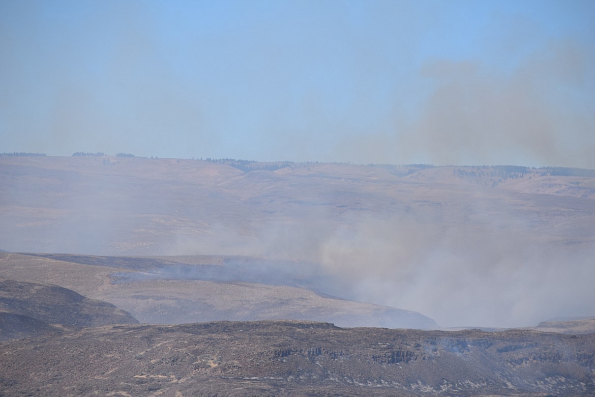 Smoke created a haze over western Grant County in early August of 2022 from what was known at the time as the Vantage Highway Fire, which burned more than 30,000 acres in Kittitas County. The terrain in the area, just across the Columbia River from the Wildhorse Monument, is rough and has several different owners. A new bill proposed by Rep. Tom Dent, R-Moses Lake, seeks to encourage cooperation between various firefighting agencies and local residents by forming Rangeland Fire Protection Associations.