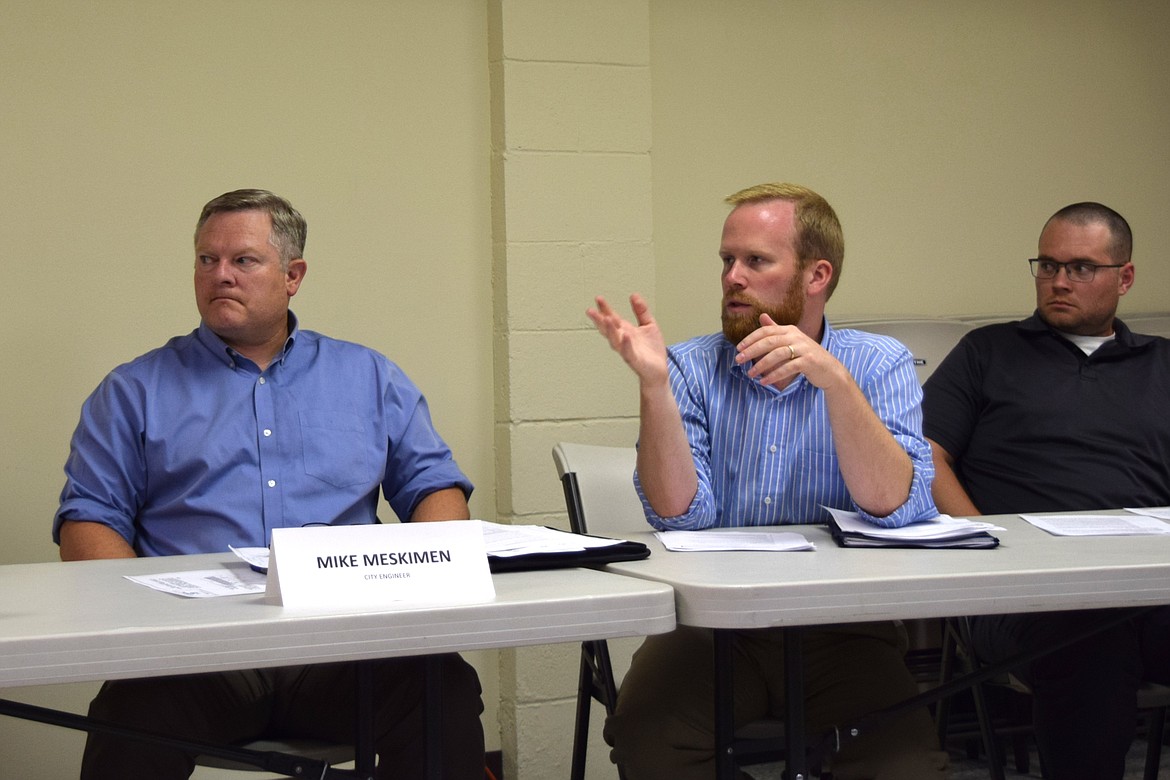 Gray & Osborne Engineer Jamin Ankney, middle, discusses water infrastructure improvements at a George City Council meeting in July. Gray & Osborne also provide contract engineering services to the city of Mattawa, with Ankney discussing legislative appropriations funding with the Mattawa City Council during Thursday’s regular meeting.