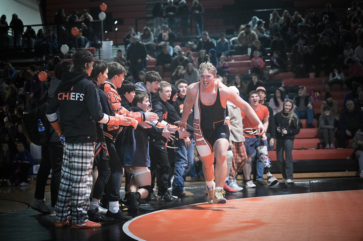 Ronan wrestler Jackson Davis makes a gleeful run down the gauntlet during the wrestling portion of Ballers and Brawlers in Ronan. (Christa Umphrey photo)