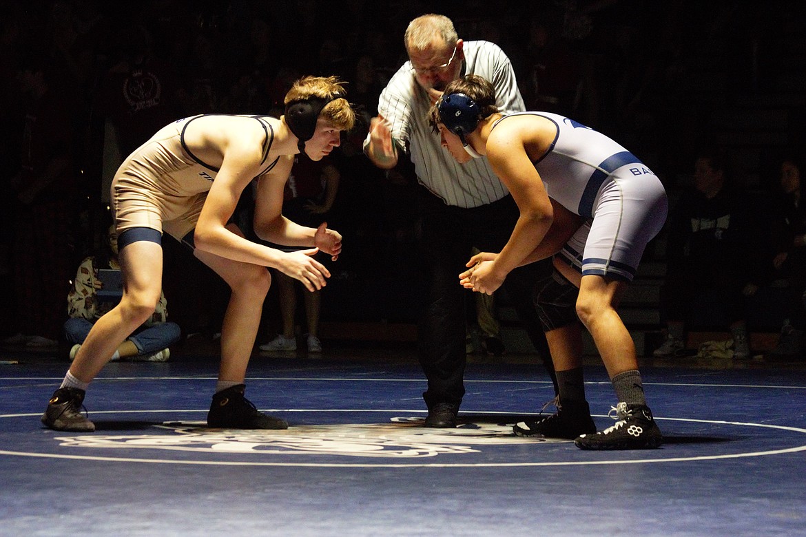 (right) Gaige Johnson faces off against Timberlake's Carter Loutzenhiser at the Backwoods Brawl.