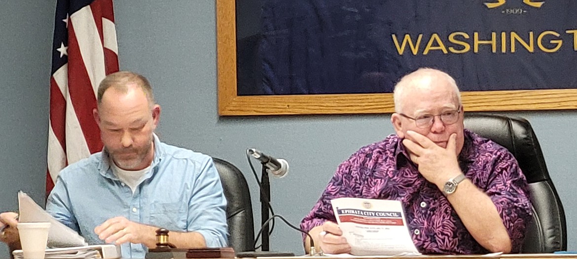 Newly-appointed Ephrata Mayor Pro Tem Matt Moore, left, and Ephrata Mayor Bruce Reim listen to presentations from staff regarding water rights and utility billing during the city's regular council meeting on Jan. 17.