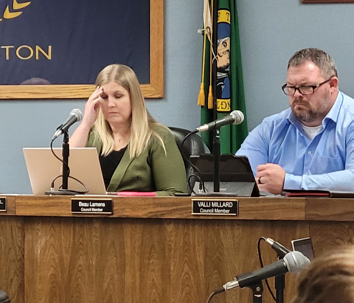 Council Members Sarah McDonnell and Beau Lamens review documents during last week's Ephrata City Council meeting. City staff are working through upgrades to the city's payroll and utility billing systems this month.