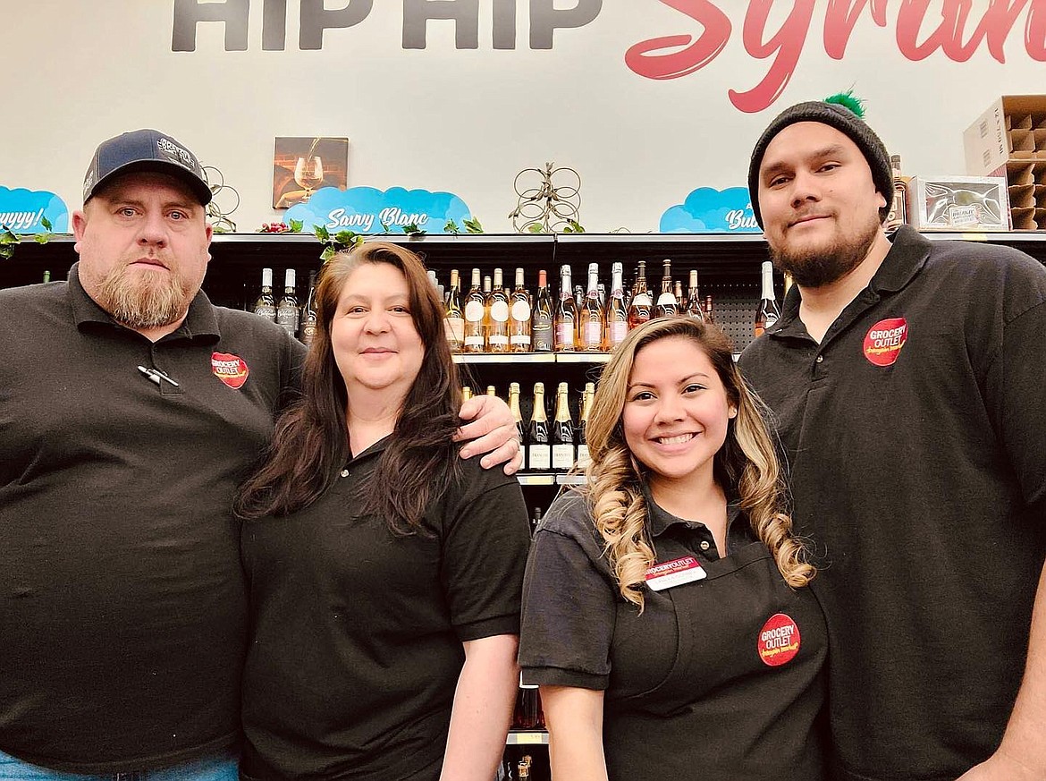 Steve and Heather Brown, left, bought the Ephrata Grocery Outlet location in late 2022 from Laulea and Holden Gorbea, right. Heather and Steve said they enjoy the community-focused culture of Grocery Outlet and have enjoyed moving to Ephrata.