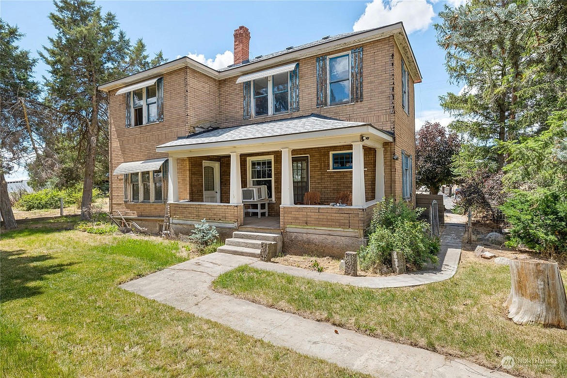 Exterior photo of the front of a 100-year-old house for sale, located at 50 Front St. in Hatton. The house was owned by the former Mayor of Hatton Harold Johnson.