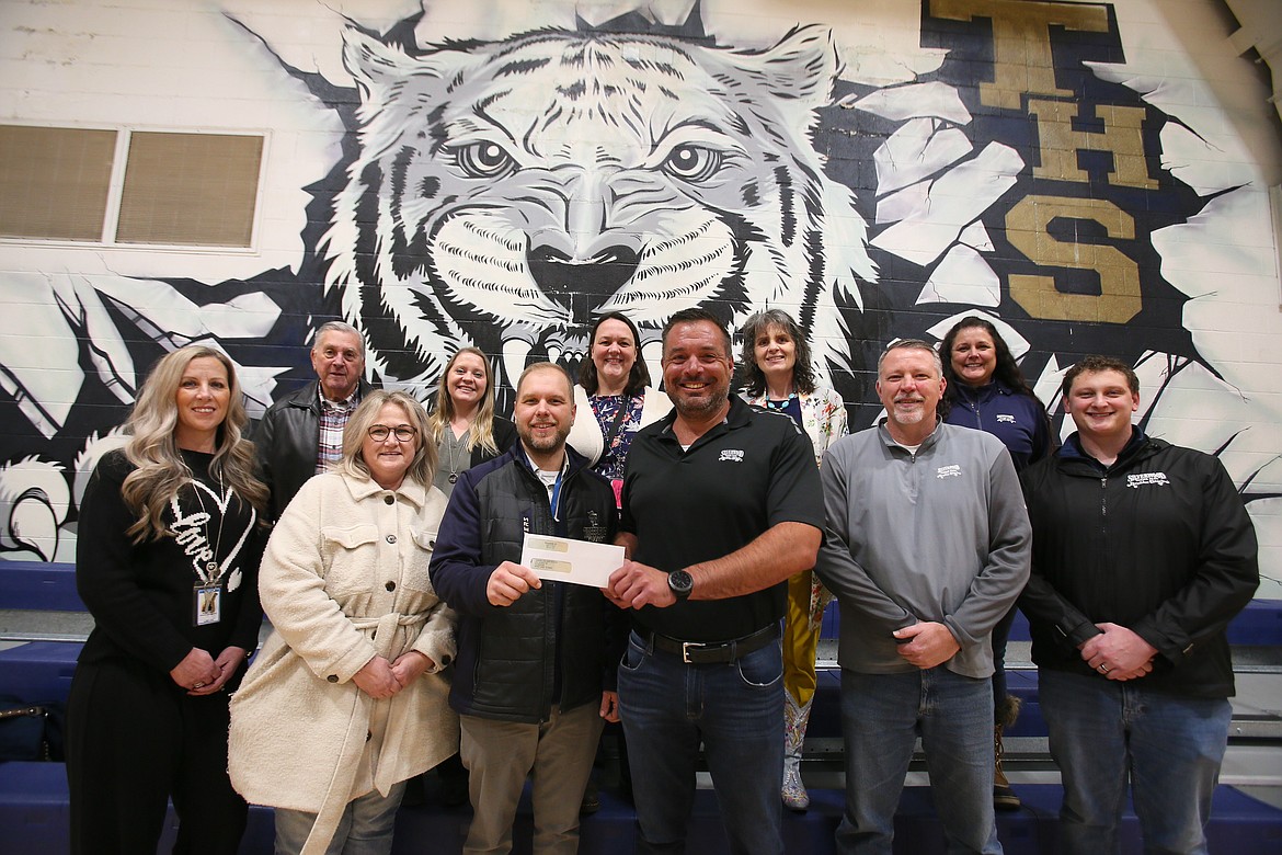 Silverwood leadership and representatives from Timberlake High and the Lakeland Joint School District gather in Timberlake's gym Wednesday to celebrate a gift of $200,000 from Silverwood to Timberlake to construct an indoor recreational facility that could break ground as early as this spring. Front row, from left: Lynn Paslay, Michelle Thompson, Ryne Eberlin, Paul Norton, Juston Henry and Michael Thompson. Back row, from left: Bob Jones, Jessica Grantham, Randi Bain, Ramona Grissom and Michele Sheets.