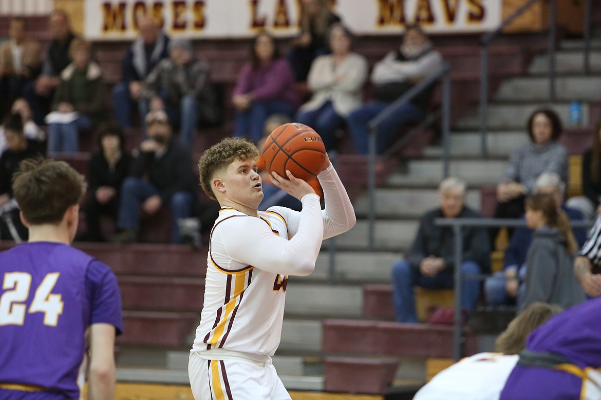 Moses Lake junior Brayden Kast, in white, attempts a free throw in the first quarter against Lewiston Tuesday.