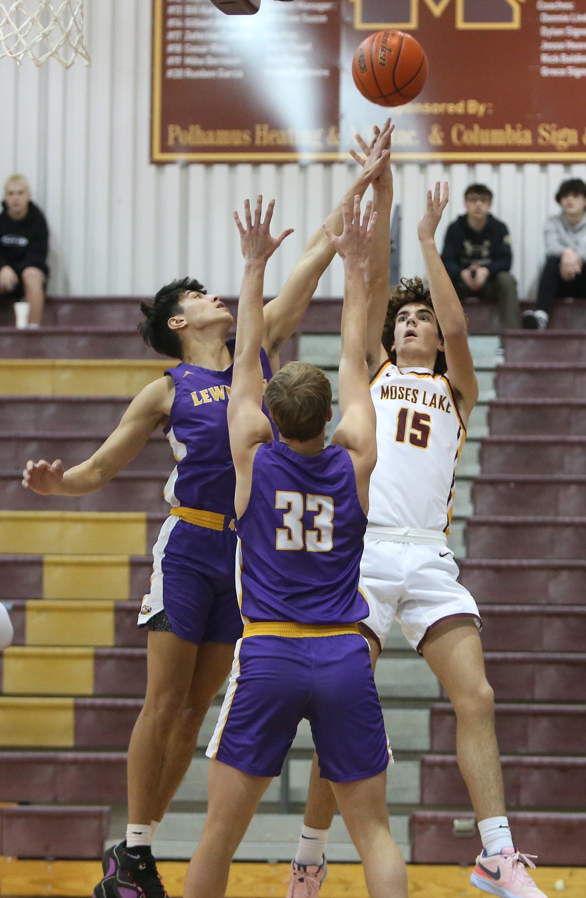 Moses Lake sophomore Grady Walker (15) attempts a jump shot in the first half against Lewiston.