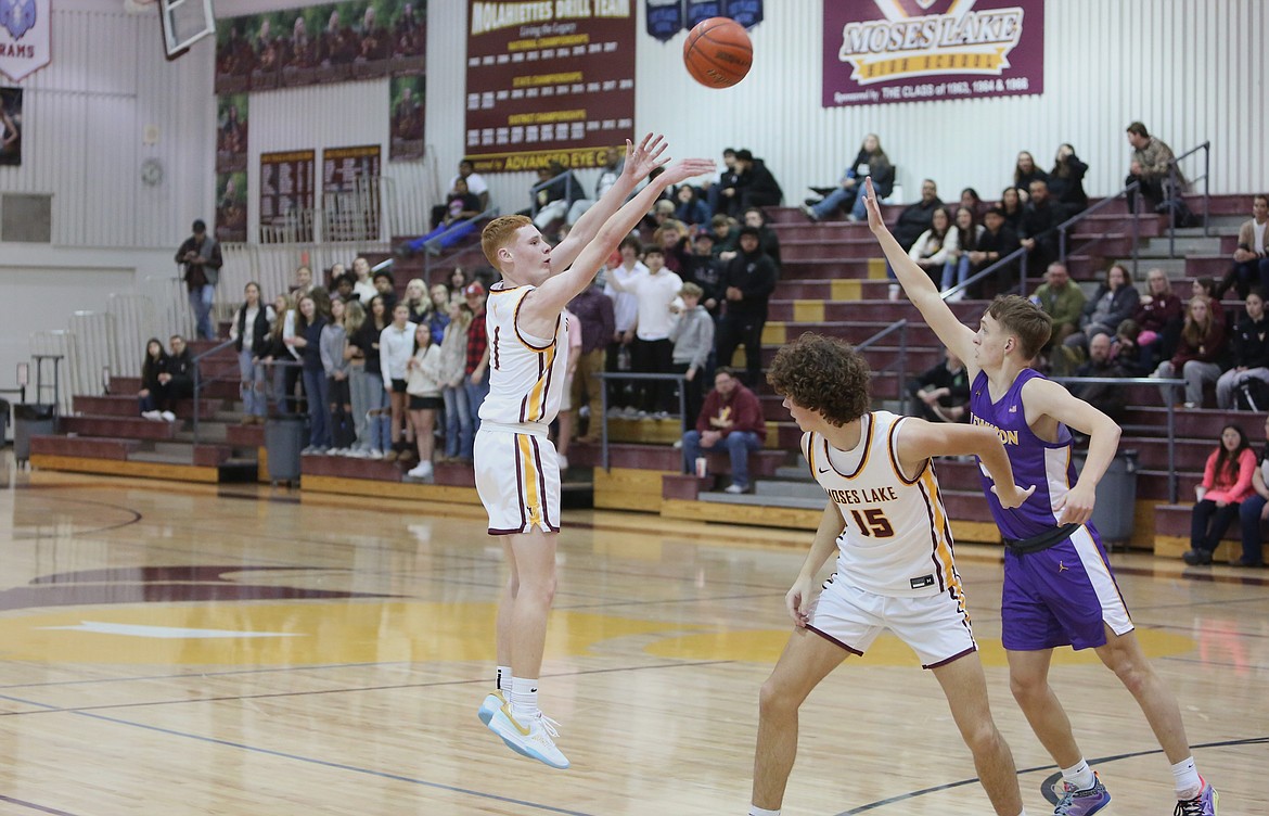 Moses Lake sophomore Kyre Wiltbank, left, shoots a three-pointer in the second quarter against Lewiston.