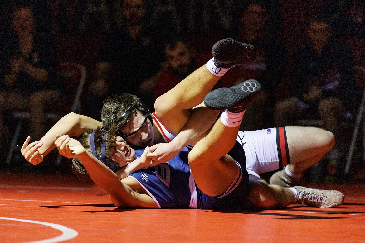 Sandpoint senior Matthew Clifton wrestles Kai Aitken of Bonners Ferry during the Battle for the 'B' Cup on Wednesday night.