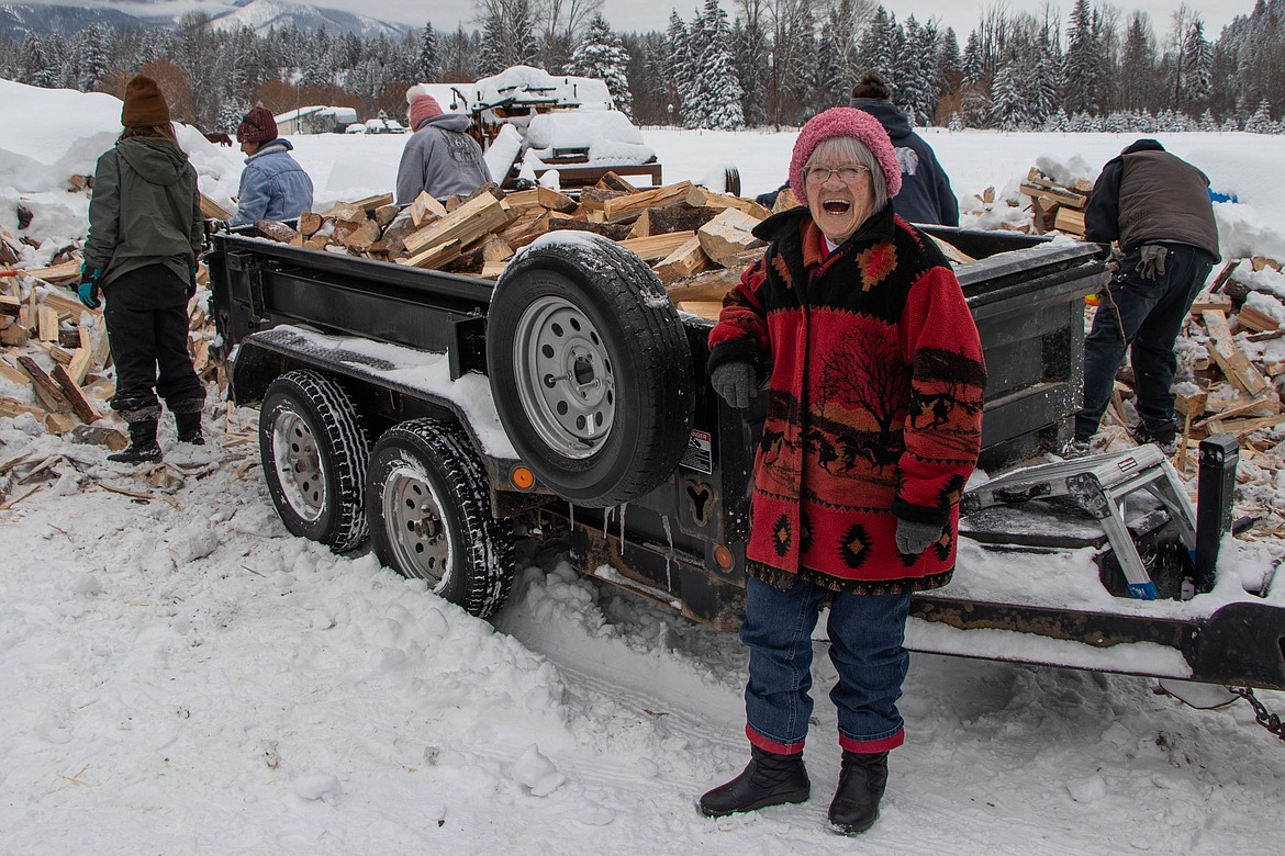 Ethel White, former mayor of Eureka and a volunteer at the St Michael & All Angels Wood Ministry in Fortine stands next to her family's delivery truck on Jan. 20, 2024. (Kate Heston/Daily Inter Lake)