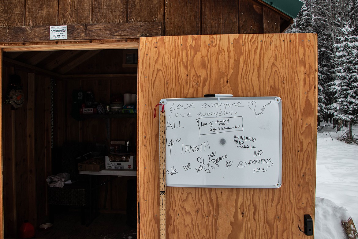 A whiteboard at the St Michael & All Angels Wood Ministry in Fortine encourages volunteers. (Kate Heston/Daily Inter Lake)