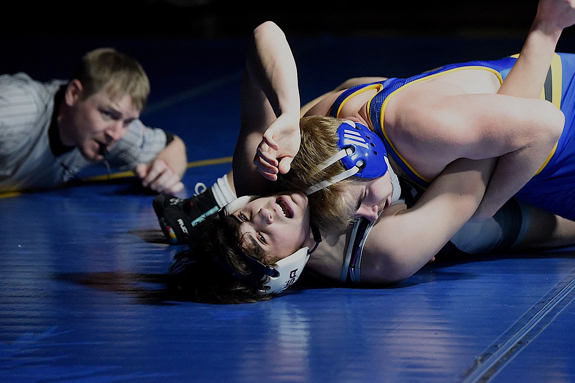 Libby's Joey Wise has Polson's Mac Campbell nearly pinned during Tuesday night's match. Wise won by fall. (Scott Shindledecker/The Western News)