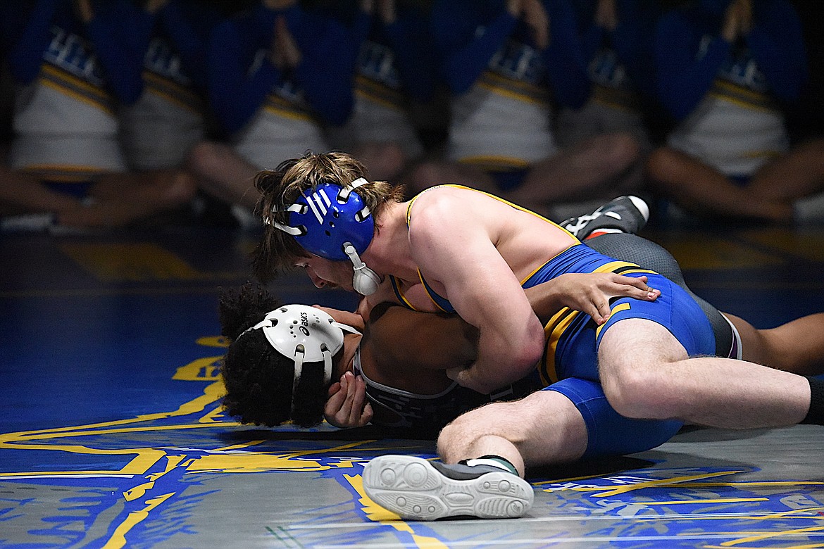 Libby's Zekiah Meyer faces off against Polson's Gabe Houston during Tuesday night's match. Meyer won by fall. (Scott Shindledecker/The Western News)